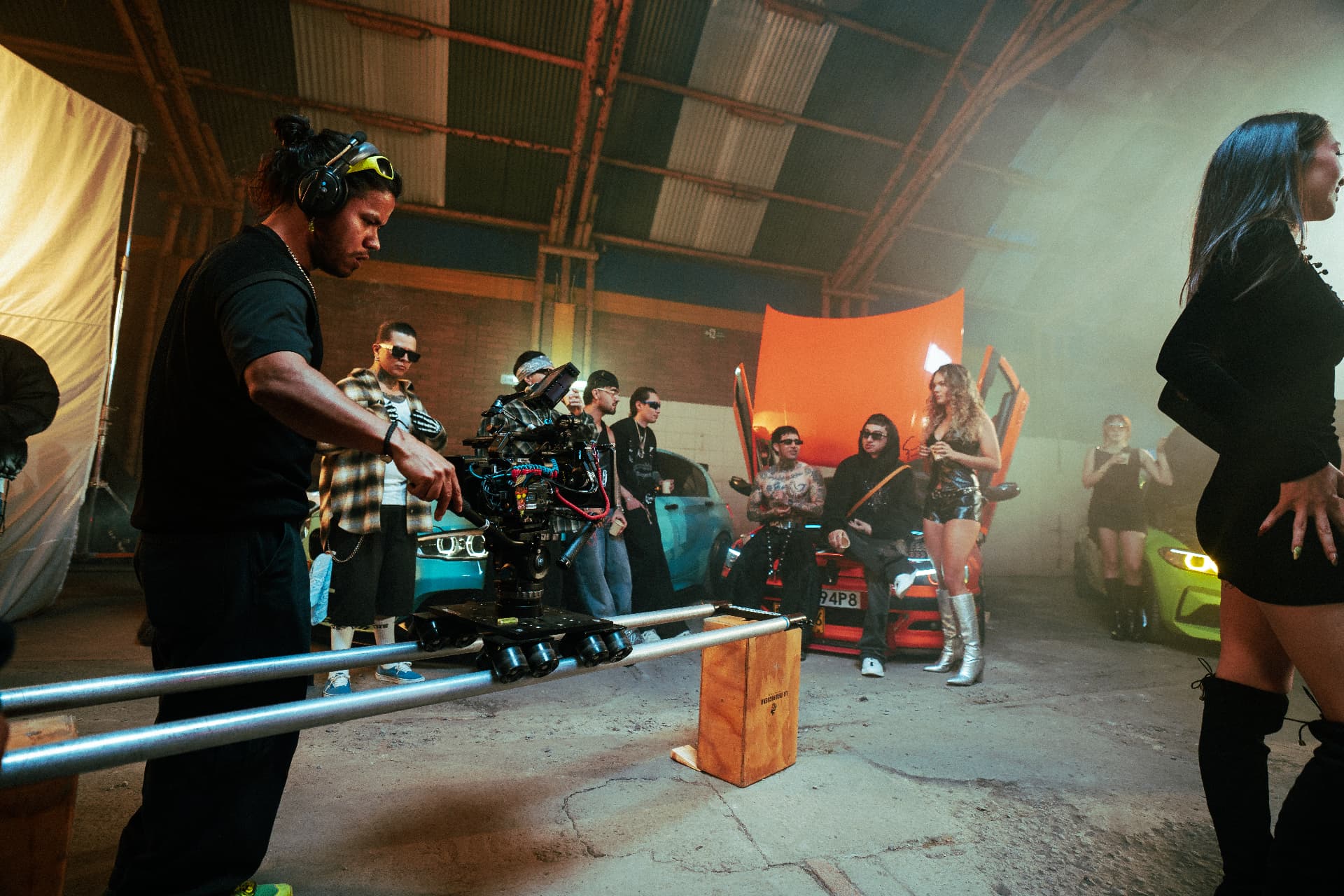 Camera operator on a dolly track during the Reloxito shoot.